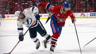 Joel Armia #40 of the Montreal Canadiens skates against Tyler Johnson #9 of the Tampa Bay during Game Four of the 2021 NHL Stanley Cup Final at the Bell Centre