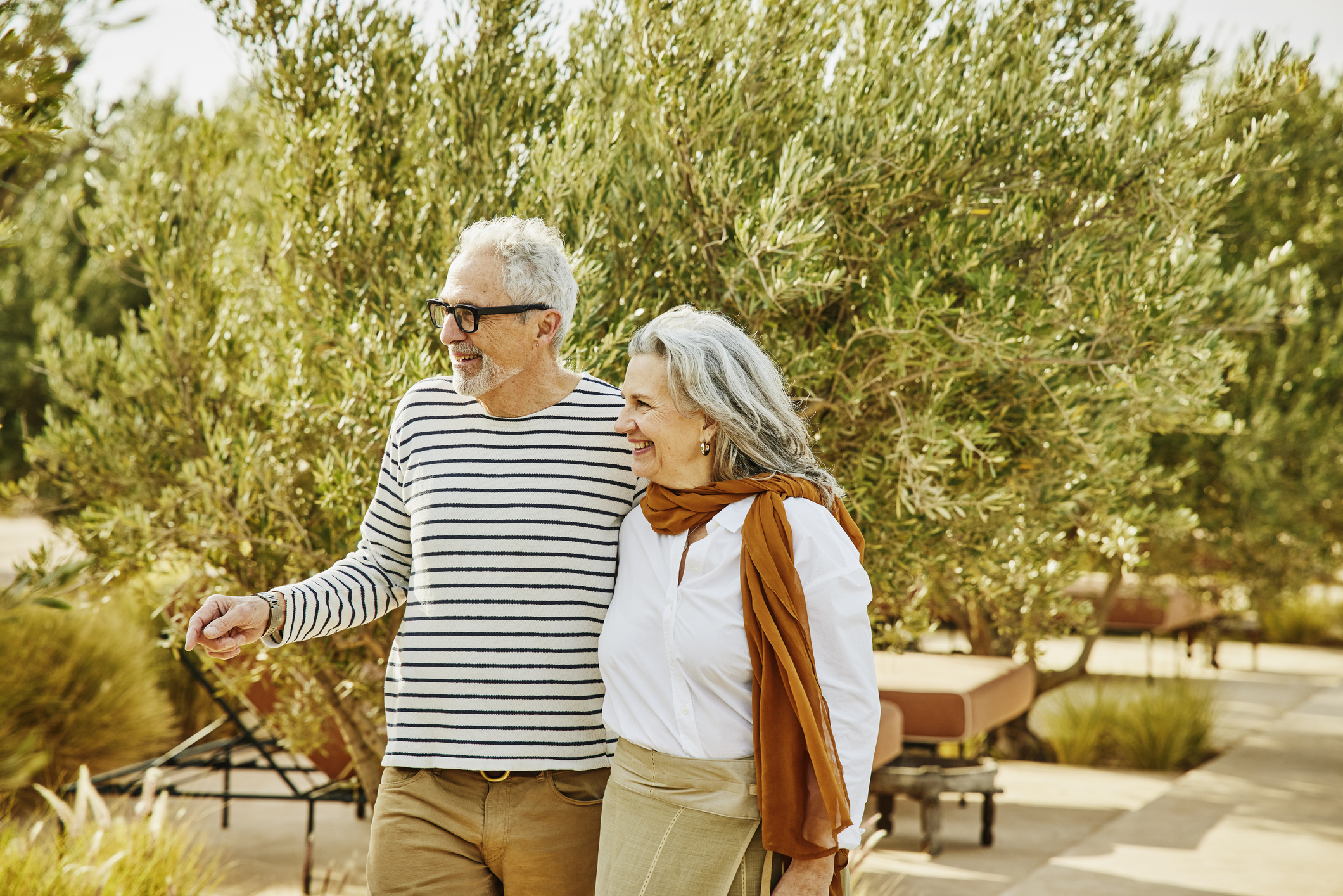 A couple walking through a nice park