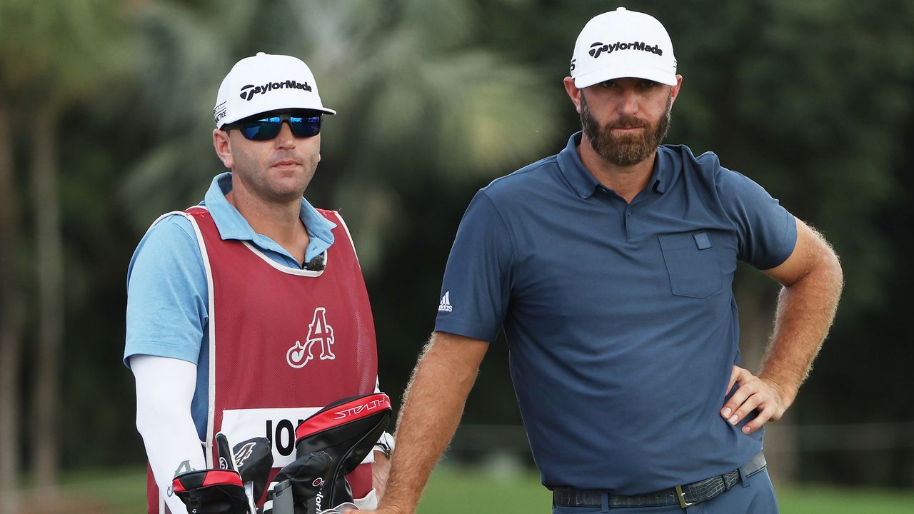 Caddie Austin Johnson with brother Dustin Johnson on the course