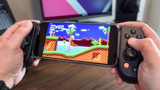 Playing Sonic on the Backbone Pro in front of a desk setup