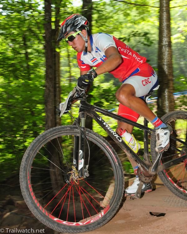 A Costa Rican rider descends through the trees