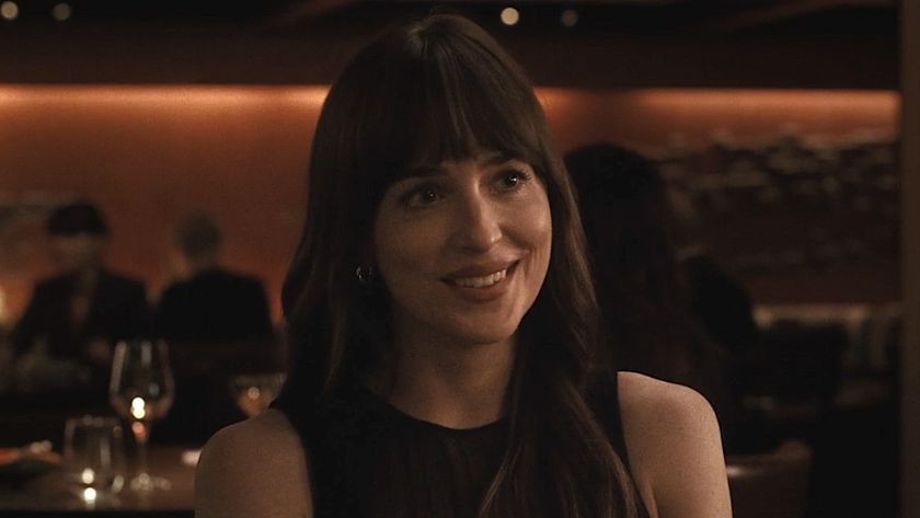 Lucy smiling at Harry on restaurant date in Materialists