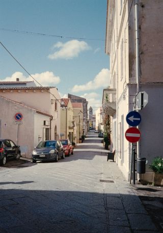 View down a long residential street in Italy