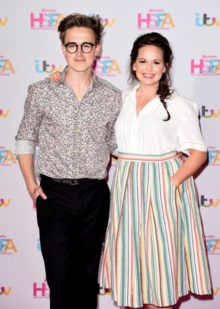 Tom and Giovanna Fletcher embraced the colourful floral theme (Ian West/PA)