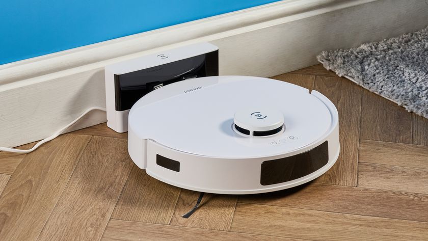 Ecovacs Deebot N20 in white photographed vacuuming floor