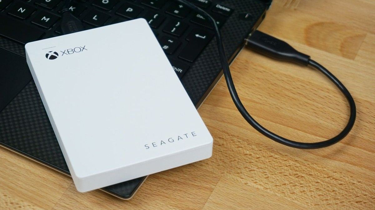 The Seagate Game Drive for Xbox One and Xbox Series X|S connected via USB to a laptop. 