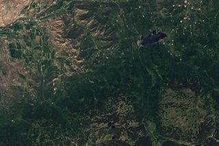 This Landsat 8 image from June 20, 2013, shows the region before the landslide.