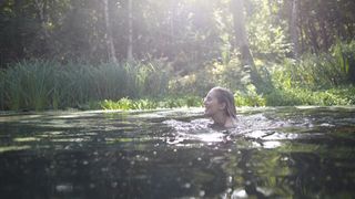 A woman swimming in a lake