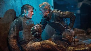 (L-R) Tom Cruise as Major William Cage and Emily Blunt as Sergeant Rita Vrataski in "Edge of Tomorrow" now streaming on Netflix