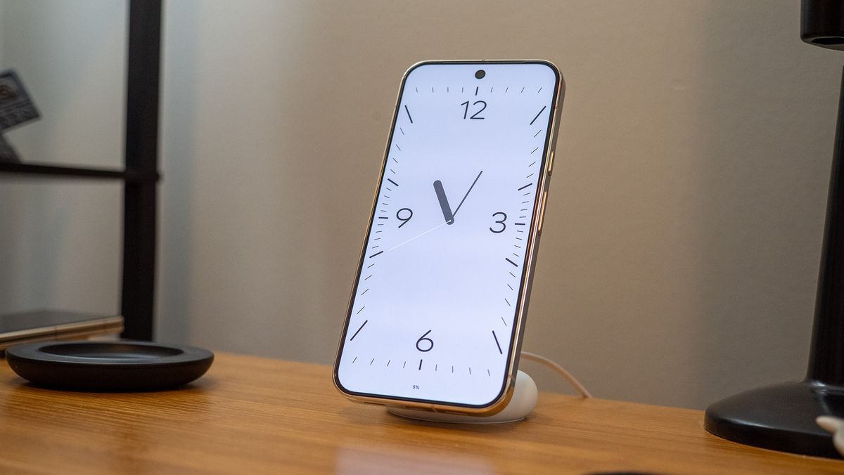 A Google Pixel 10 Pro XL on a Pixelsnap wireless charger with the screensaver function activated