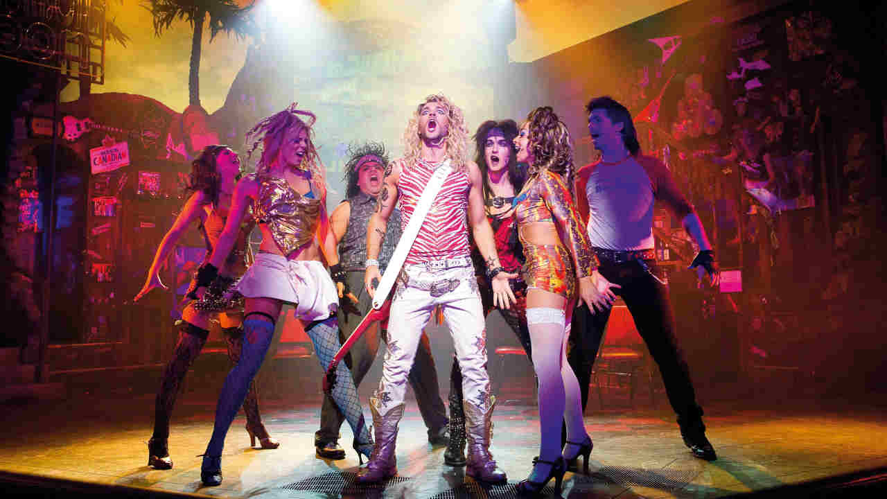 The cast of Rock Of Ages the musical performing onstage