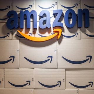 Amazon logo in front of Amazon boxes