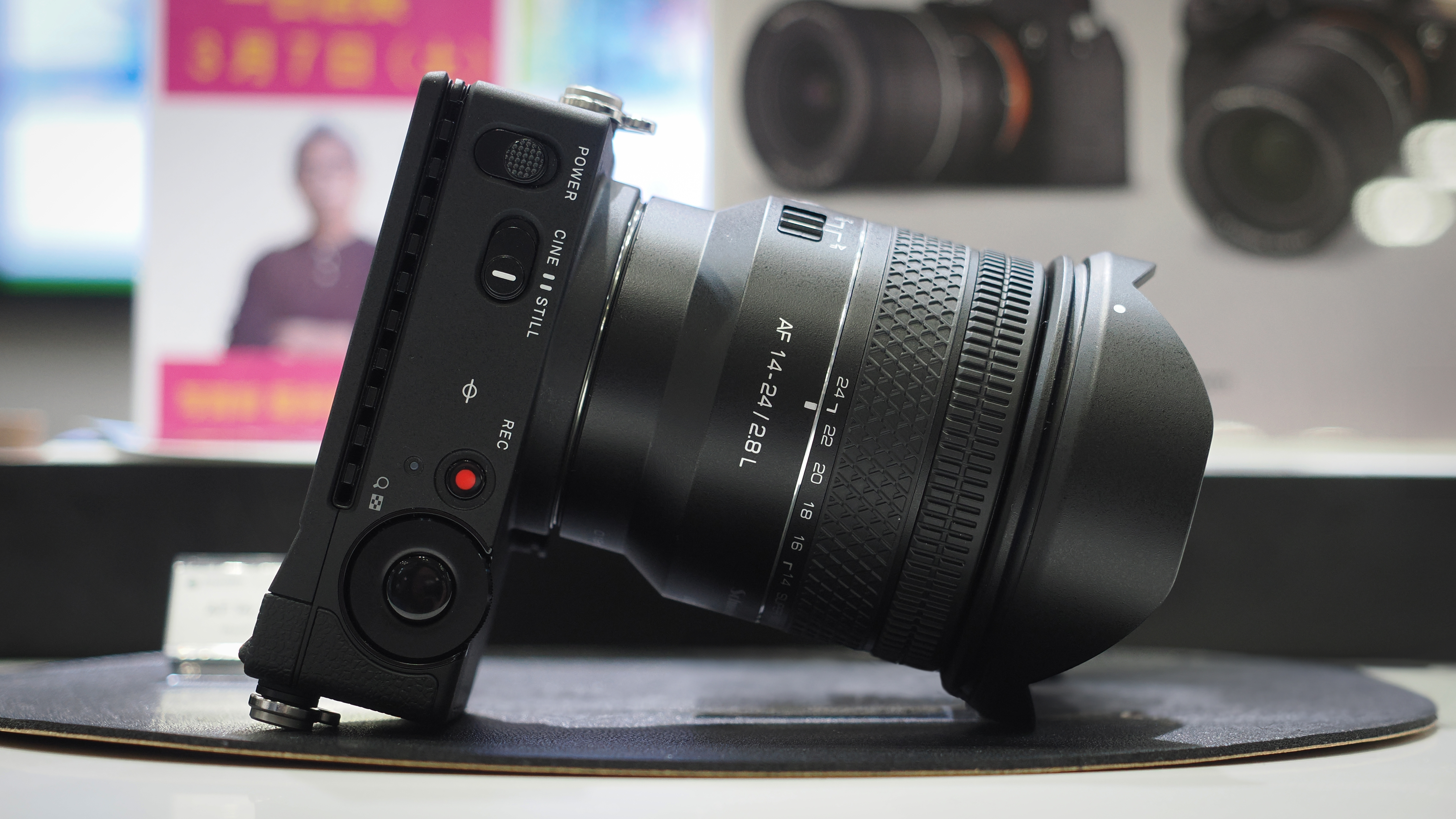 The Samyang x Schneider Kreuznach AF 14-24mm f/2.8 lens attached to a Sigma fp body at the CP+ 2026 show