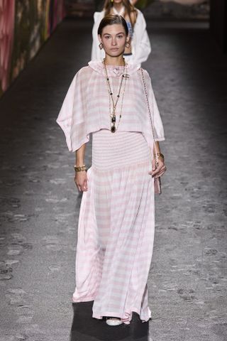 a runway model walks the Chanel spring 2024 runway