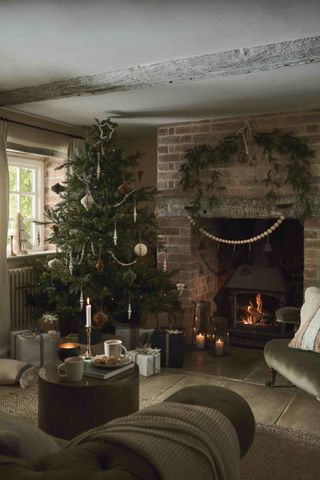 natural rustic Christmas with neutral decorations, beaded garland, log burner