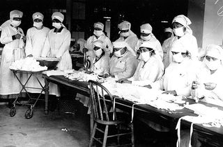 Red Cross volunteers assemble gauze masks in Boston, MA. Many cities imposed mask mandates at the height of the influenza pandemic.
