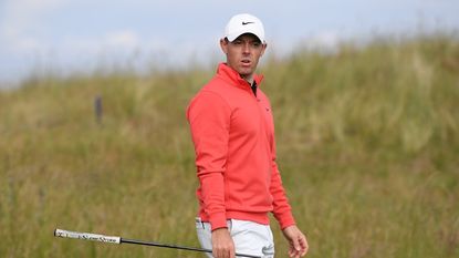 Spectator Grabs Club McIlroy's Bag