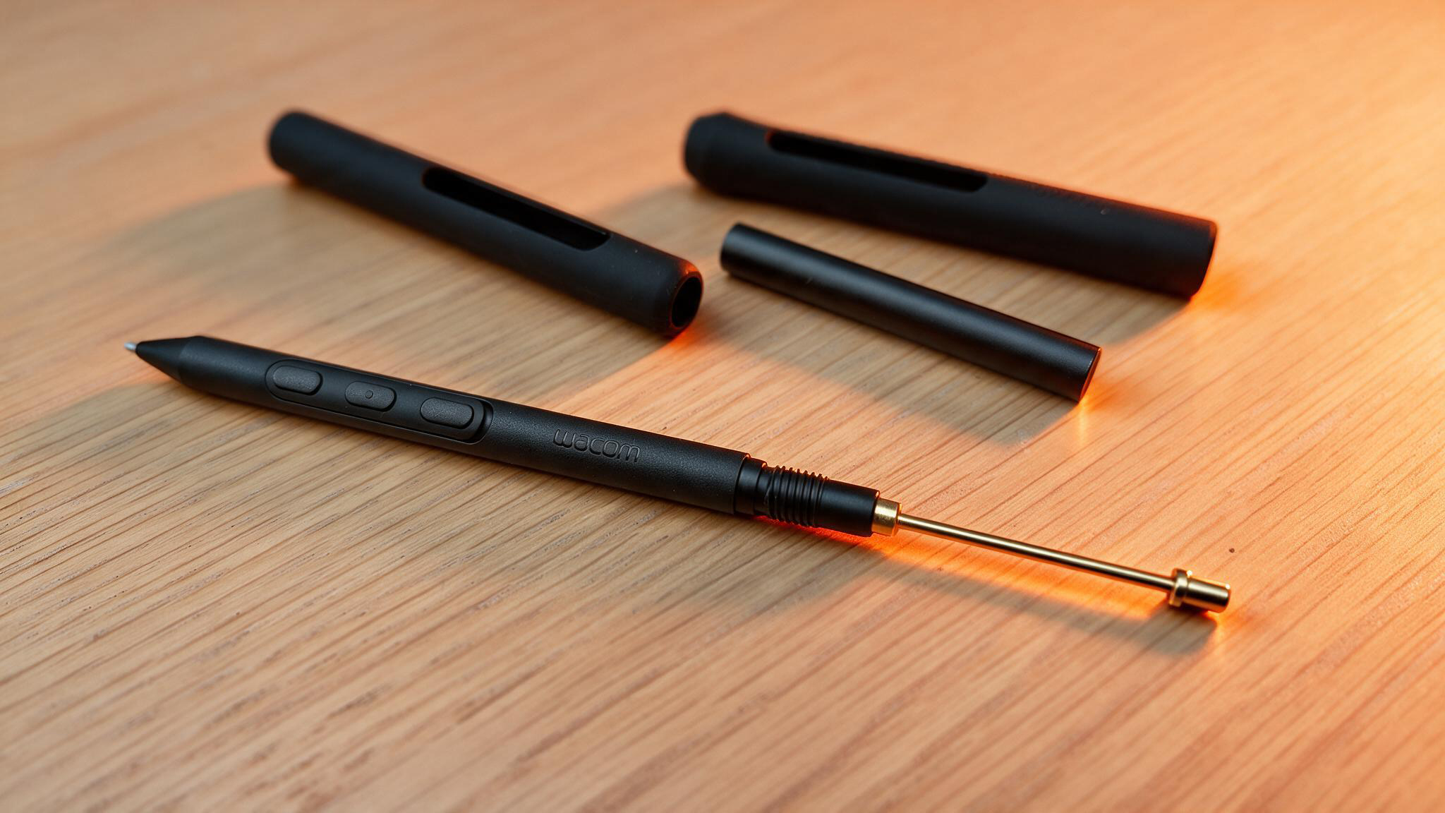 Pro Pen 3 stylus on a wooden table
