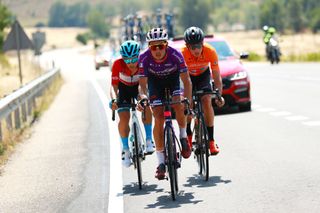 VILLADIEGO SPAIN AUGUST 03 LR Diego Pablo Sevilla of Spain and EoloKometa Cycling Team Red Mountain Jersey Jess Ezquerra Muela of Spain and Team Burgos BH and Xavier Mikel Azparren Irurzun of Spain and Team Euskaltel Euskadi compete in the breakaway during the 44th Vuelta a Burgos 2022a Stage 2 a 158km stage from Vivar del Cid to Villadiego on August 03 2022 in Villadiego Spain Photo by Gonzalo Arroyo MorenoGetty Images