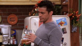 Joey Tribbiani (Matt LeBlanc) eats chips in the Friends episode "The One with the Rumor."