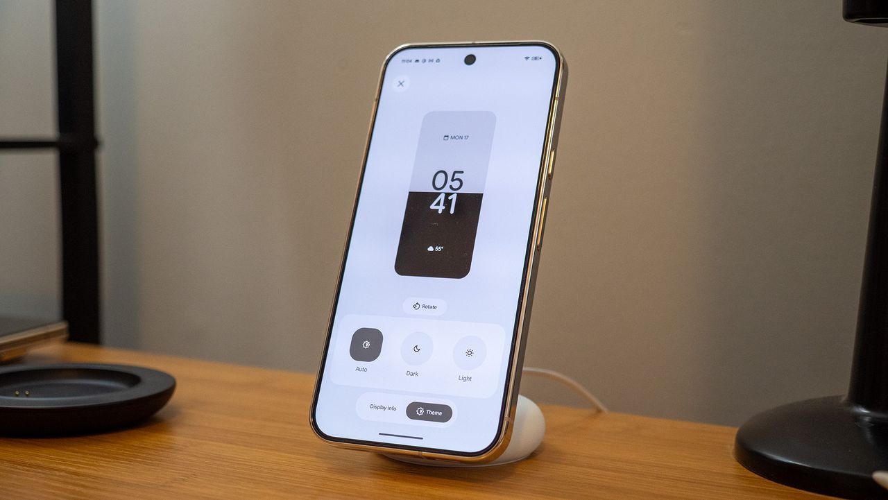 A Google Pixel 10 Pro XL on a Pixelsnap wireless charger with the screensaver function activated