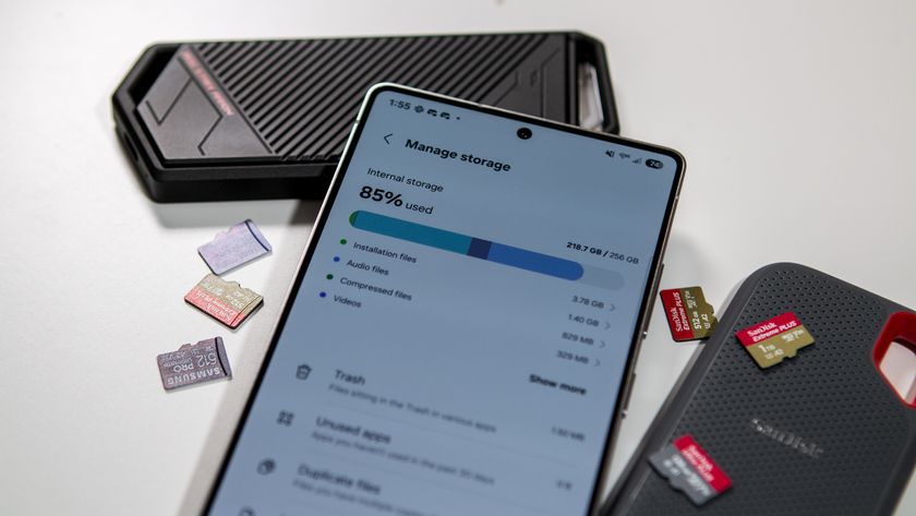 Manage Storage on the Samsung Galaxy S25 Ultra surrounded by microSD cards and portable SSDs