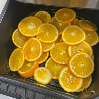 Freshly cut oranges inside an air fryer