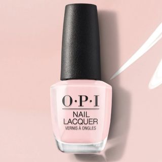 OPI's Put it in Neutral Nail Polish shade pictured on a sheer, milky pink background - to represent the polish colour