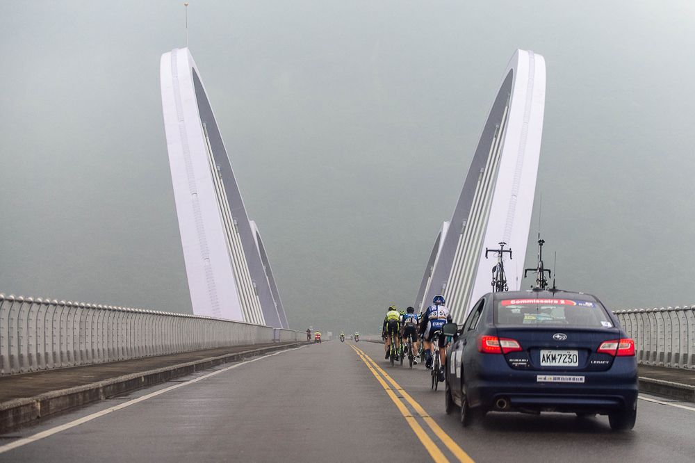 The breakaway travels over a bridge at the Tour de Taiwan.