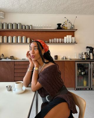 Amaka Hamelijnck posing at a cafe