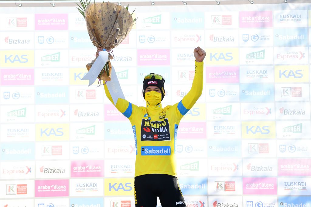 ERMUALDE LAUDIO SPAIN APRIL 07 Podium Primoz Roglic of Slovenia and Team Jumbo Visma Yellow Leader Jersey Celebration during the 60th ItzuliaVuelta Ciclista Pais Vasco 2021 Stage 3 a 1677km stage from Amurrio to Ermualde Laudio 481m Mask Covid safety measures Flowers itzulia ehitzulia on April 07 2021 in Ermualde Laudio Spain Photo by David RamosGetty Images