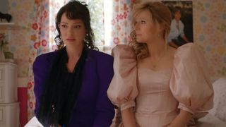 katherine heigl and sarah chalke wearing 80s dresses sitting in a girl's bedroom in firefly lane