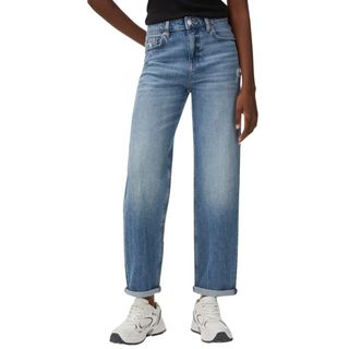 M&S blue Boyfriend Ankle Grazer Jeans on a model, teamed with trainers 