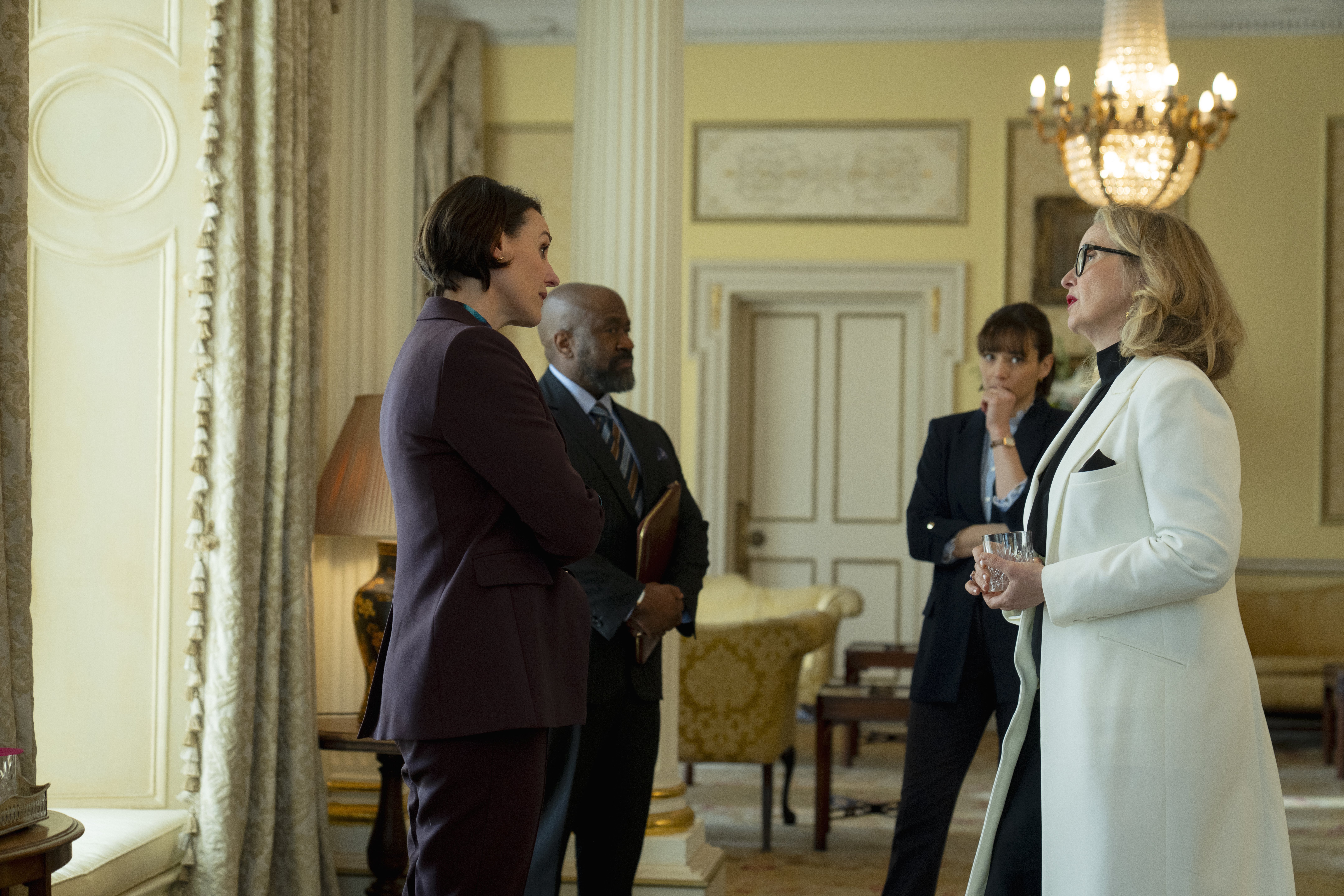 a group of government officials speak in a fancy british office in the hostage