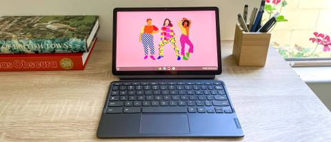 Lenovo IdeaPad Duet 3 Chromebook sitting open on desk with screen on showing home screen