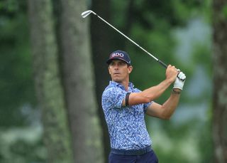 Billy Horschel strikes an iron and watches its flight