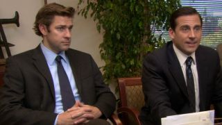 Jim and Michael sitting next to each other on The Office.