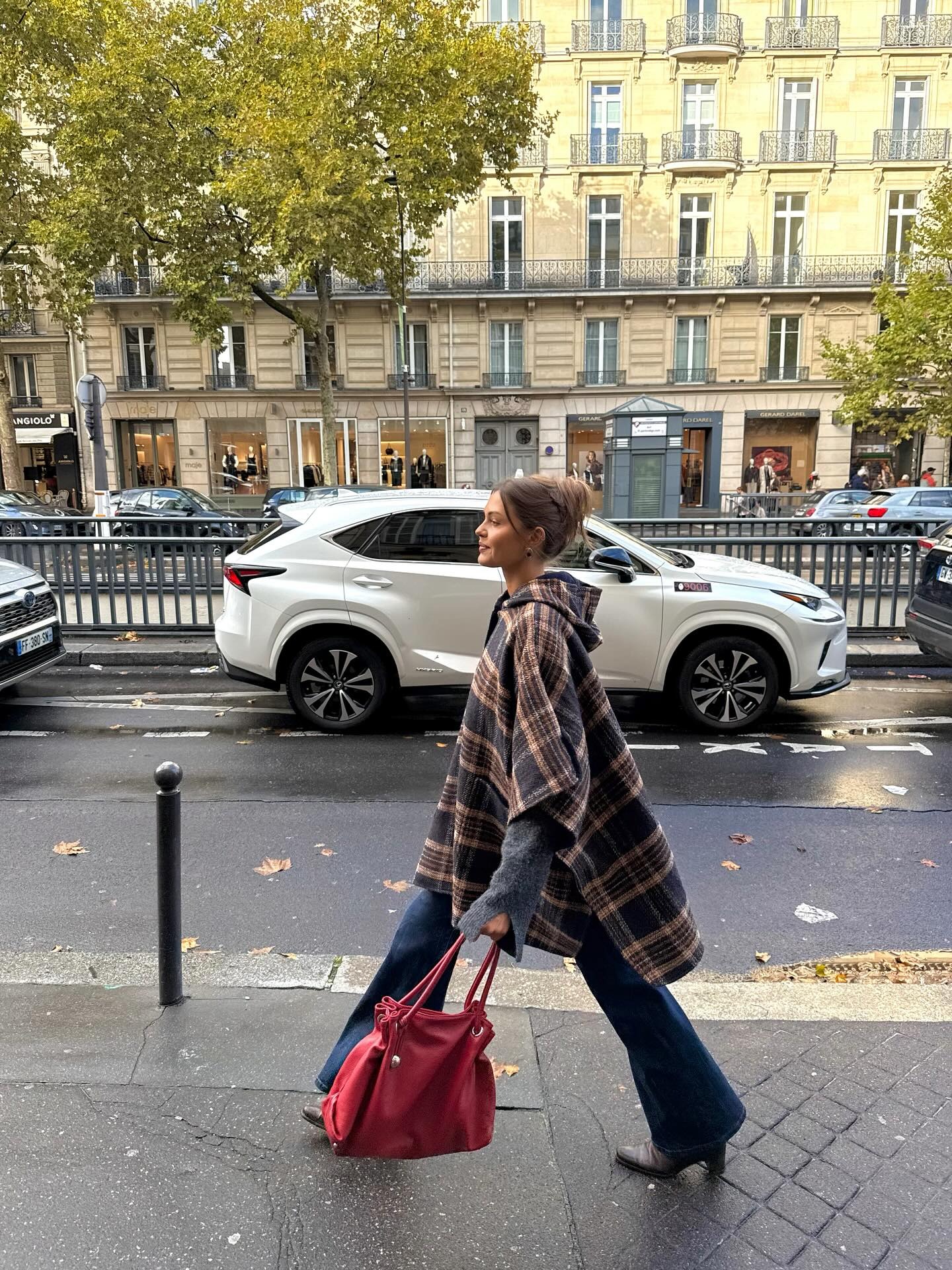 Fashion person Sofia Boman wears the French Women Poncho Trend.