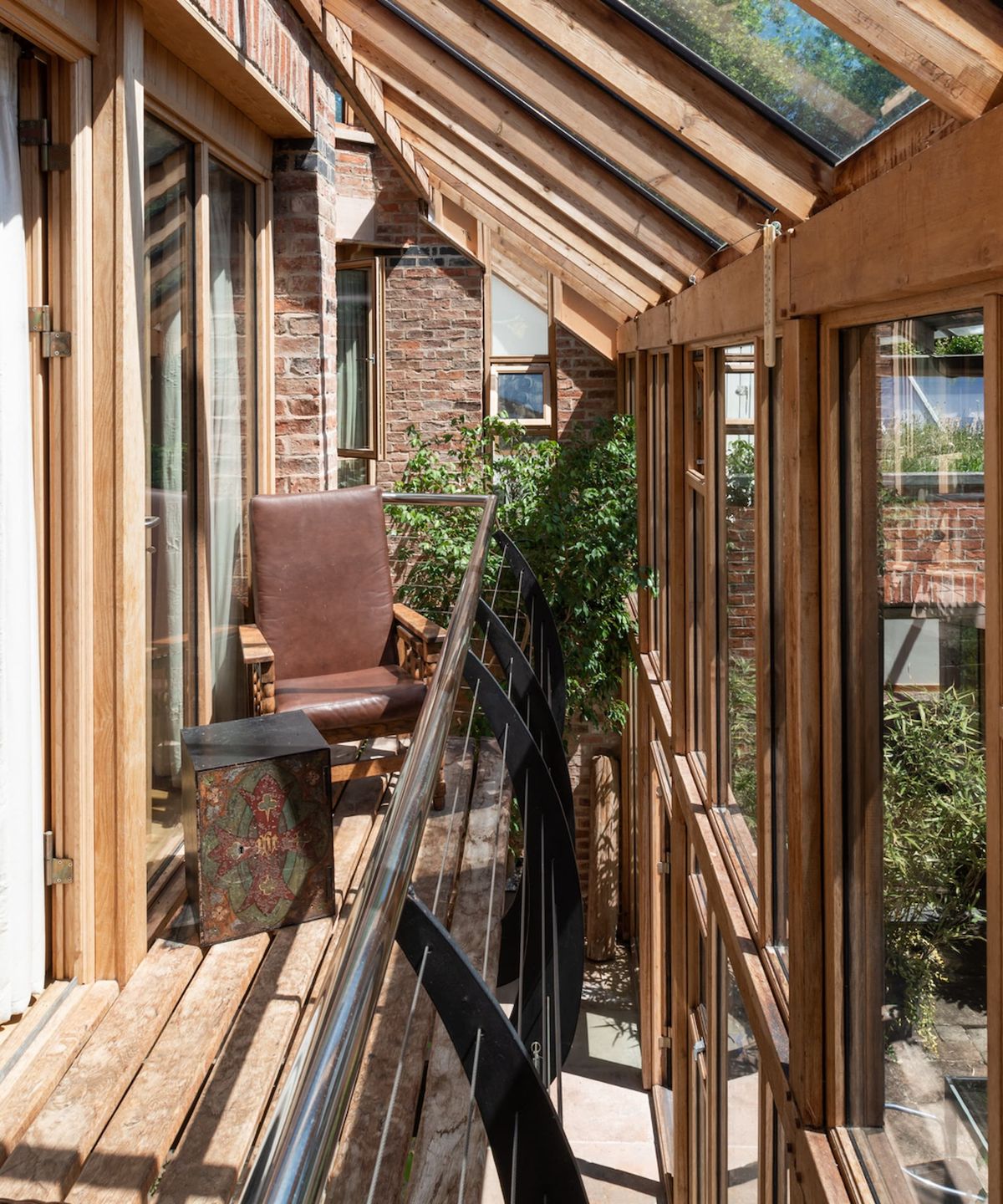 A balcony with separated wooden floorboards