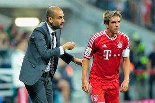 Pep Guardiola gives instructions to Philipp Lahm at Bayern Munich in August 2013.