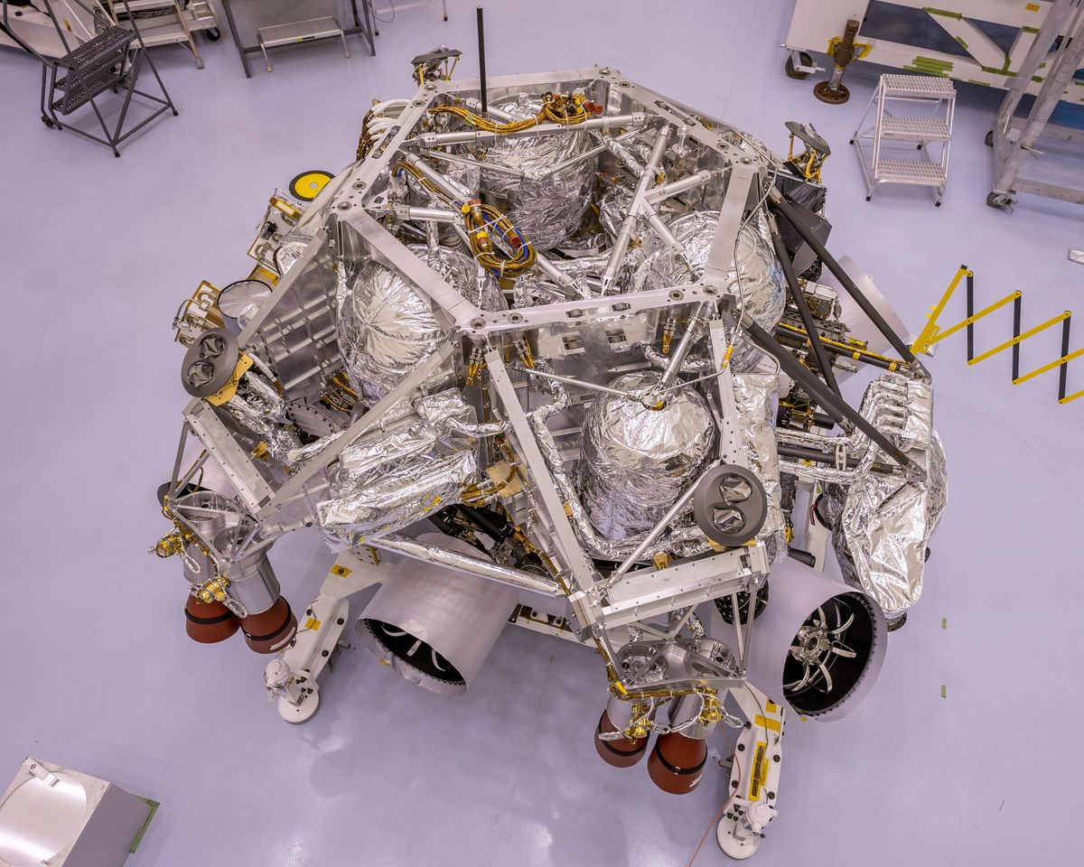 This image of the rocket-powered descent stage sitting on top of NASA&#039;s Perseverance Mars rover was taken in a clean room at Kennedy Space Center on April 29, 2020. The integration of the two spacecraft was the first step in stacking the mission&#039;s major components into the configuration they will be in while sitting atop of the Atlas V rocket.