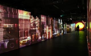 melange of boxes forms a backdrop for a video installation