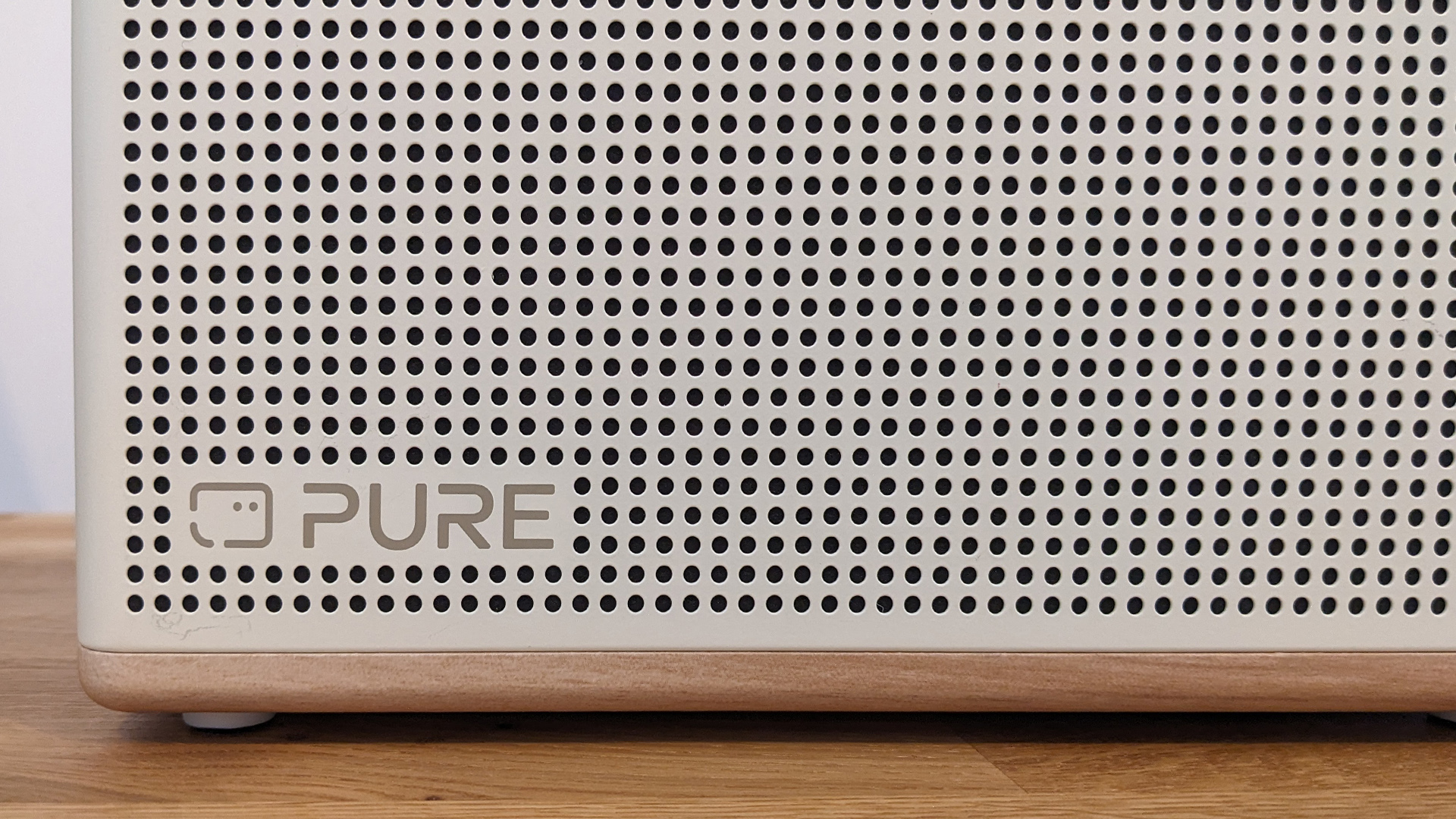 Pure Classic Aura Bluetooth speaker close up on Pure logo in bottom left corner