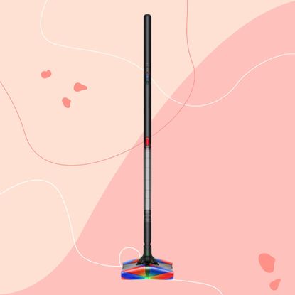 Dyson PencilVac on a pink background