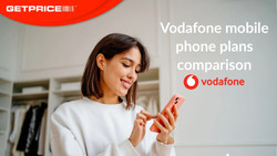 Woman smiling and looking at her phone and typing with red GetPrice logo on top left and Vodafone mobile plans comparison written in white on the right side