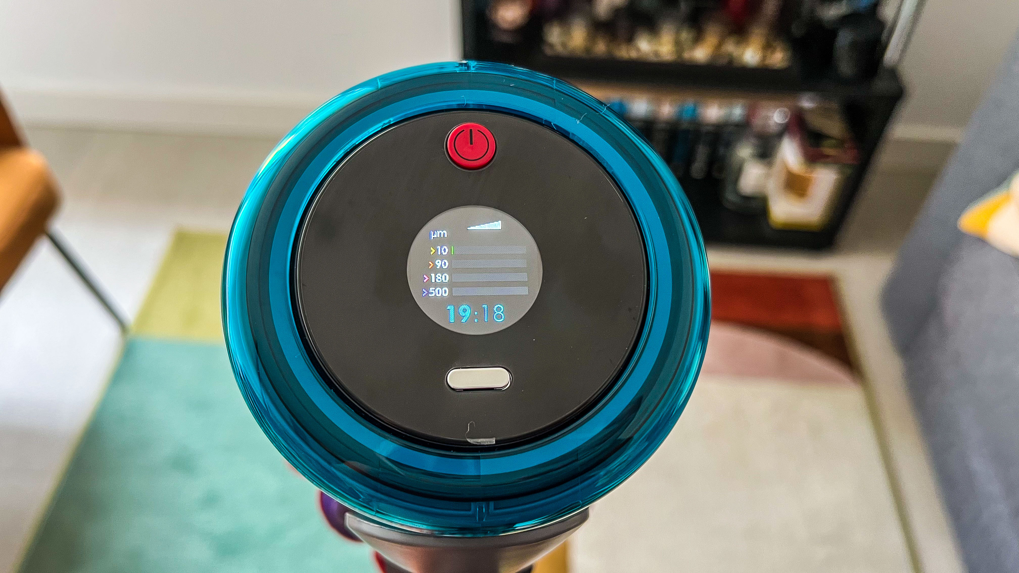 Dyson Gen5 Detect displays dirt data horizontally on the round LCD screen