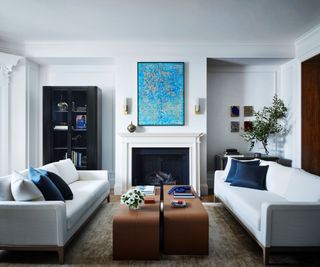 living room with white sofas and coffee table