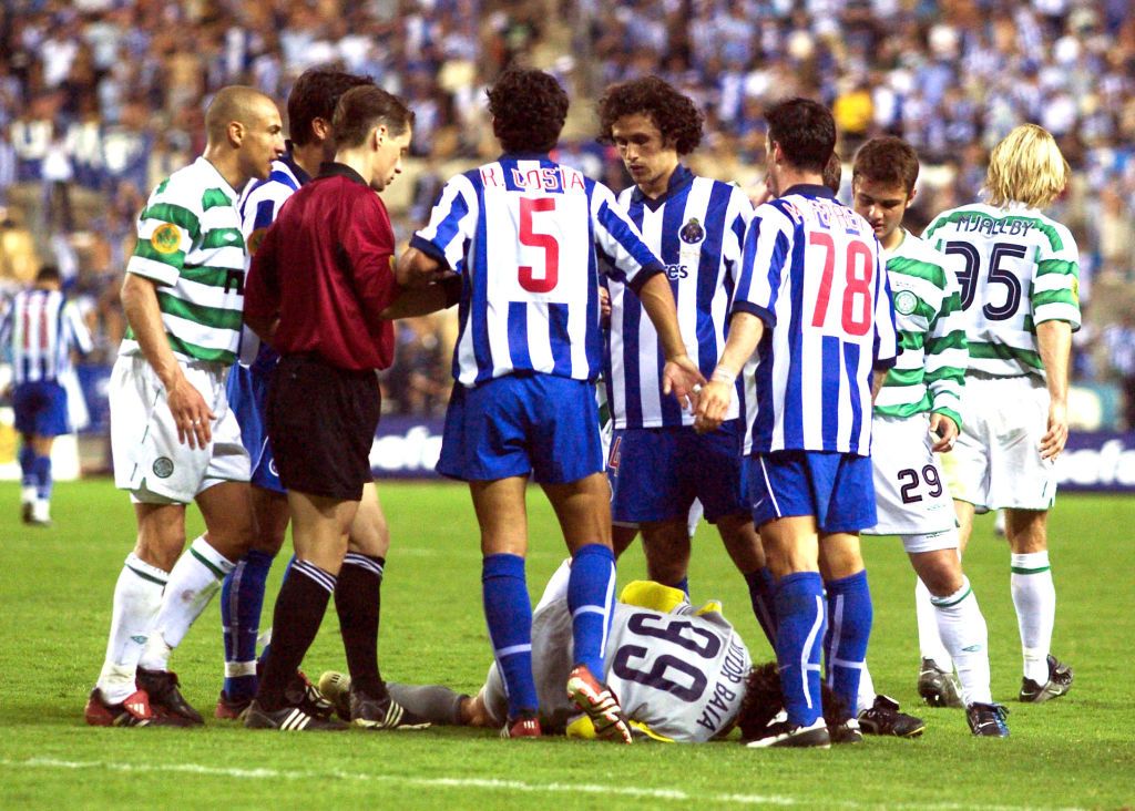 The Porto goalkeeper Vitor Baia (grounded) goes over all to easy