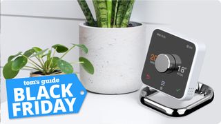 hive smart thermostat on a table with black friday deal tag