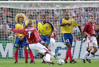 David Beckham scores from a free-kick for England against Colombia at the 1998 World Cup in France.